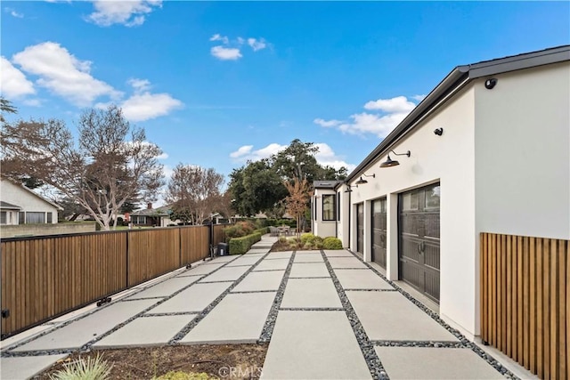 view of patio / terrace with a garage