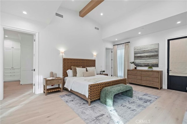 bedroom with beam ceiling, recessed lighting, visible vents, and light wood-type flooring