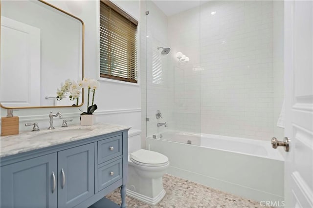 full bathroom featuring bathing tub / shower combination, toilet, and vanity