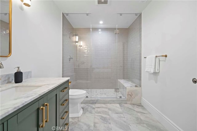 bathroom with vanity, baseboards, visible vents, a shower stall, and toilet