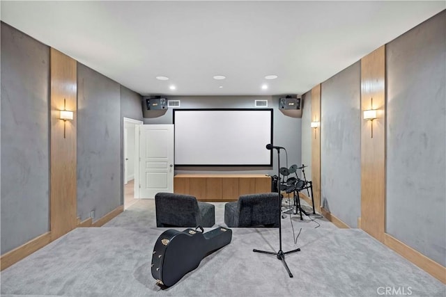 cinema room featuring baseboards, recessed lighting, visible vents, and light carpet