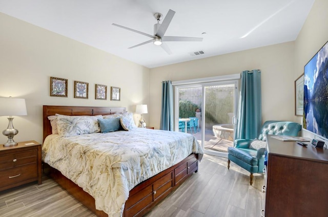 bedroom with ceiling fan, access to exterior, and light hardwood / wood-style floors