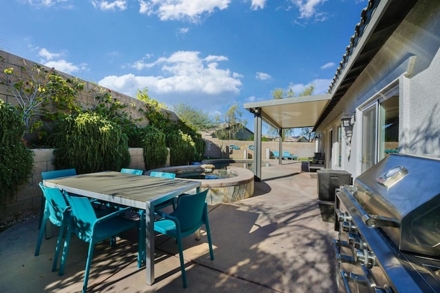 view of patio featuring a grill and a hot tub