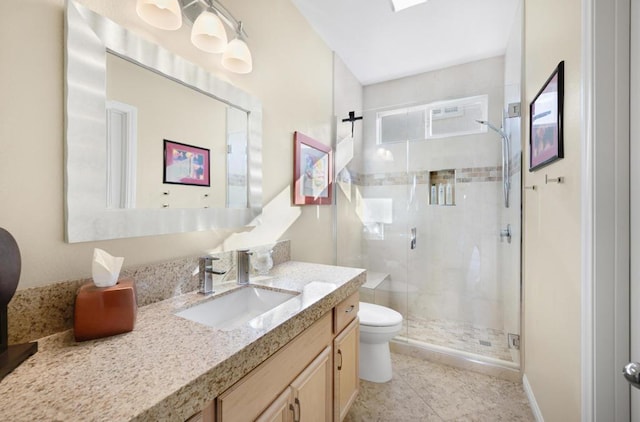 bathroom featuring a shower with shower door, toilet, vanity, and tile patterned flooring