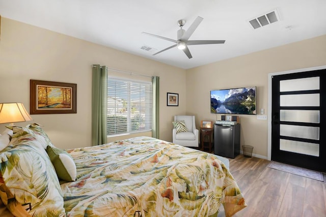 bedroom with ceiling fan and light wood-type flooring