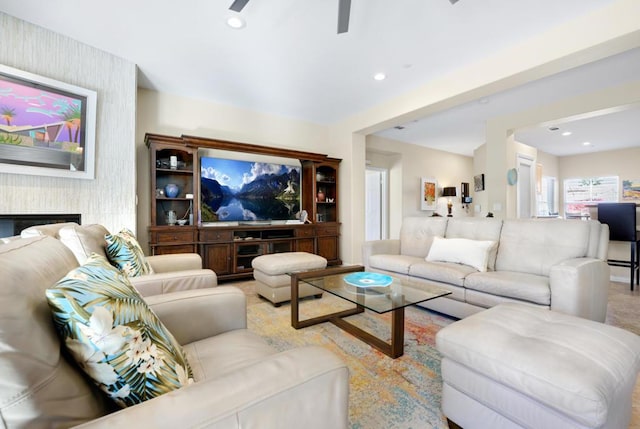 living room featuring a large fireplace