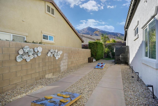 view of side of property with a mountain view