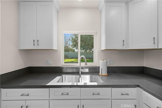 kitchen with sink and white cabinetry