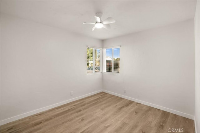 spare room with ceiling fan and light hardwood / wood-style floors