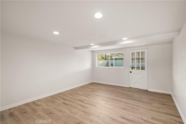 unfurnished room featuring light wood-type flooring