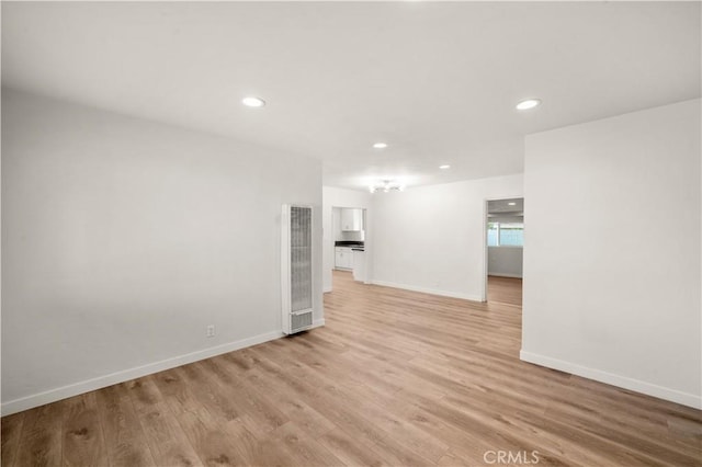 unfurnished living room featuring light hardwood / wood-style floors