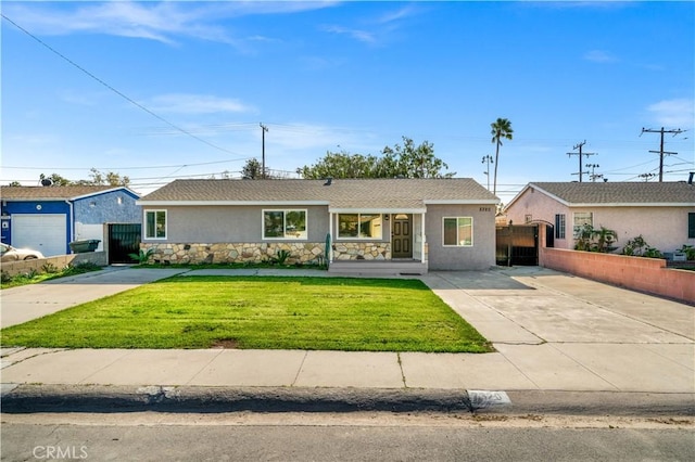 ranch-style house with a front yard and a garage