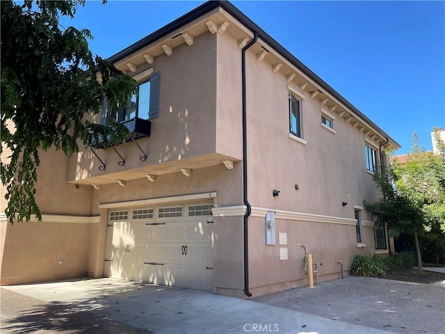 view of property exterior featuring a garage