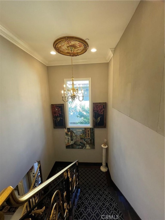 stairway featuring crown molding, carpet, and a notable chandelier