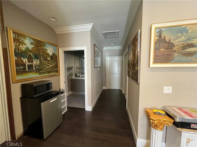 corridor with crown molding and dark wood-type flooring