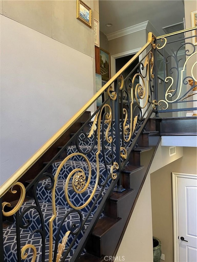 stairs featuring ornamental molding