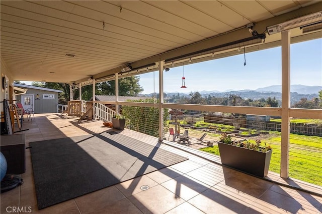 view of patio featuring an outbuilding and a mountain view