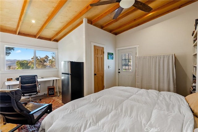 bedroom featuring ceiling fan, lofted ceiling with beams, stainless steel refrigerator, and wooden ceiling