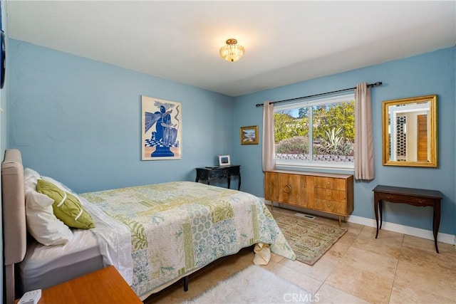 bedroom with light tile patterned flooring