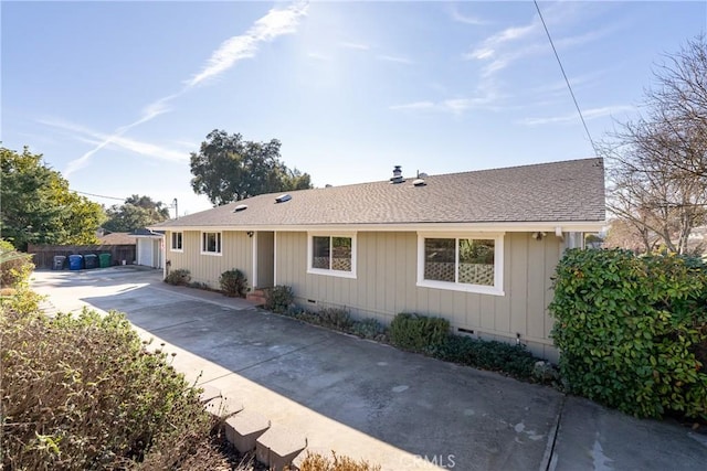 ranch-style home featuring a garage