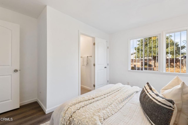 bedroom featuring dark wood-type flooring