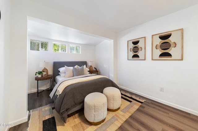 bedroom featuring dark hardwood / wood-style flooring