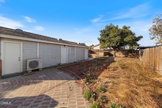 view of yard with a patio area and ac unit