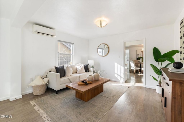 living room featuring an AC wall unit and wood-type flooring