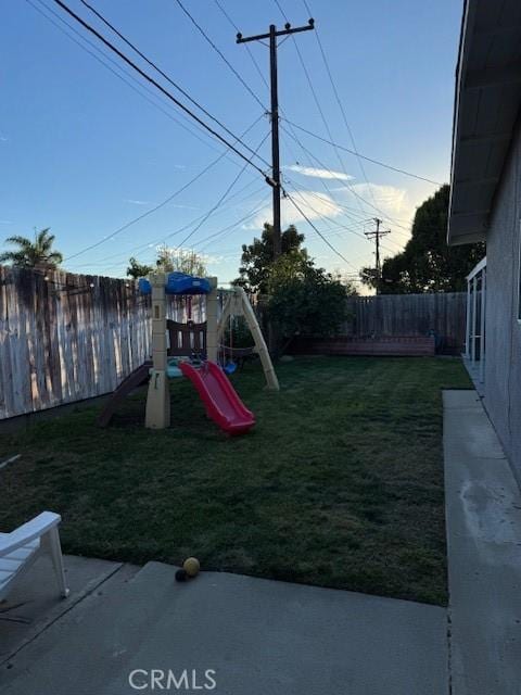 view of play area with a yard