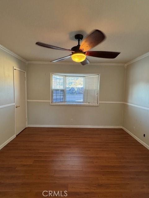 unfurnished room with ceiling fan, dark hardwood / wood-style flooring, and crown molding