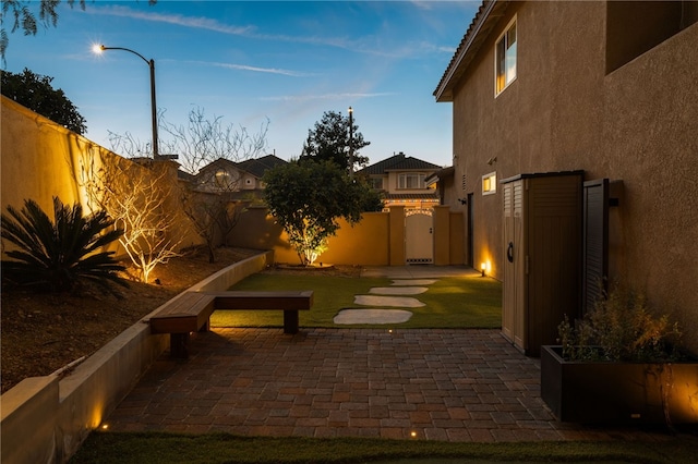 view of patio terrace at dusk