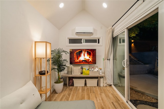 interior space with lofted ceiling and an AC wall unit