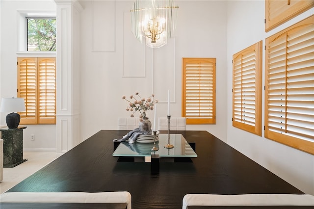 dining area featuring an inviting chandelier