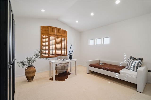 home office featuring vaulted ceiling and carpet flooring