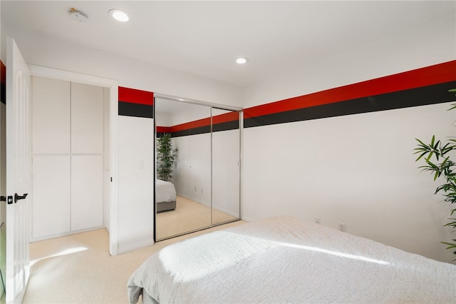 bedroom featuring a closet and carpet