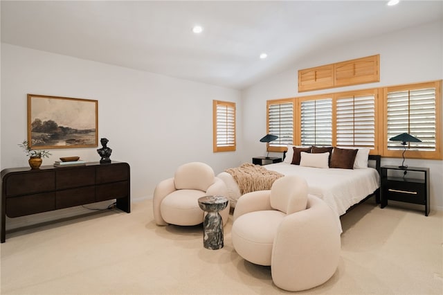 carpeted bedroom featuring lofted ceiling