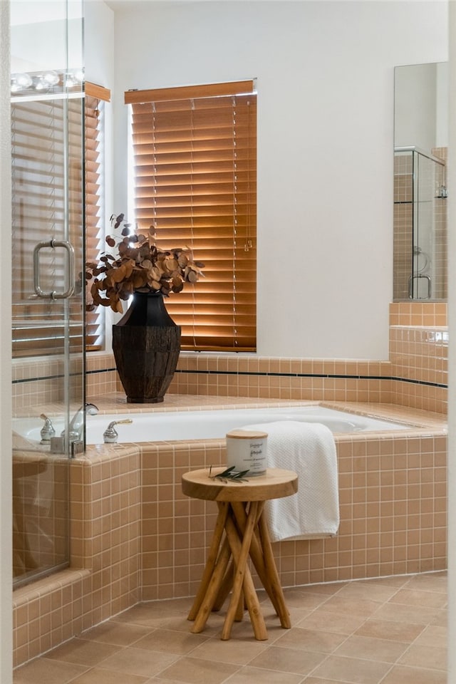 bathroom featuring an enclosed shower and tile patterned floors