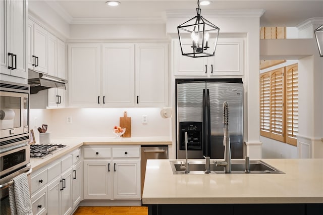 kitchen featuring hanging light fixtures, white cabinets, an inviting chandelier, and stainless steel appliances