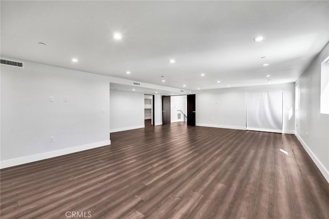 unfurnished living room with dark hardwood / wood-style floors