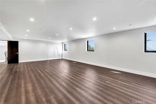 unfurnished room featuring dark wood-type flooring