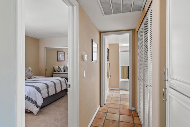 hallway with light tile patterned floors