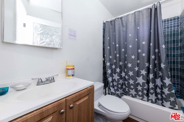 full bathroom featuring toilet, vanity, and shower / tub combo