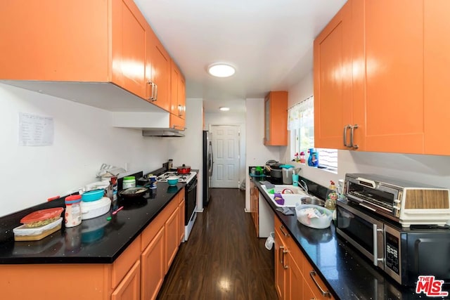 kitchen featuring dark wood-type flooring, appliances with stainless steel finishes, and sink