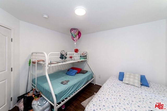 bedroom featuring dark wood-type flooring