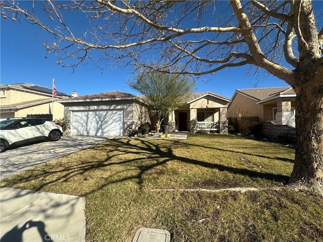 single story home with a front lawn and a garage