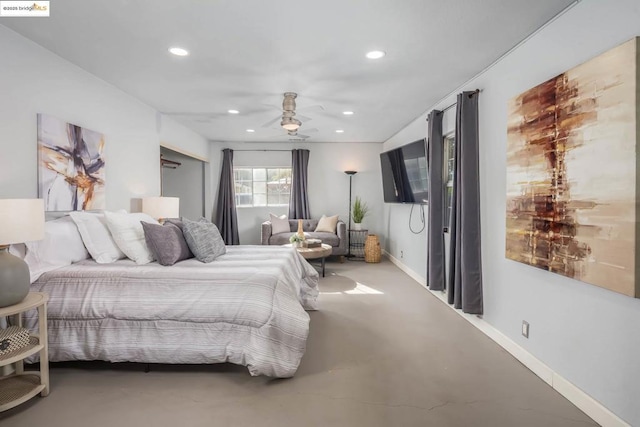 bedroom with ceiling fan and concrete flooring