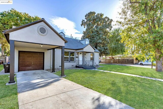 view of front of property with a front lawn and a garage