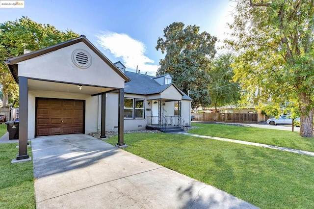 view of front of home featuring a garage and a front yard