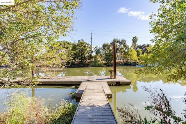 view of dock with a water view