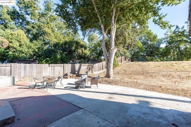 view of patio / terrace with a fire pit